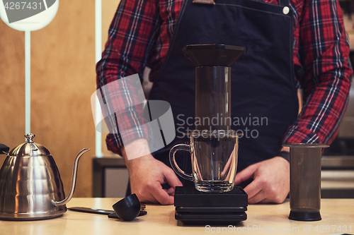 Image of Barista brewing aeropress coffee