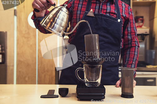 Image of Barista brewing aeropress coffee