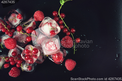 Image of Frozen berries on wooden table