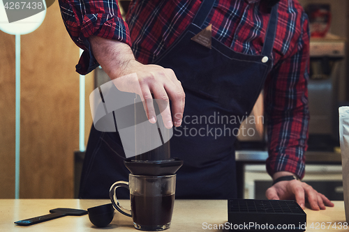 Image of Barista brewing aeropress coffee