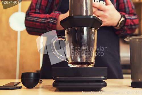 Image of Barista brewing aeropress coffee