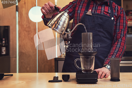 Image of Barista brewing aeropress coffee