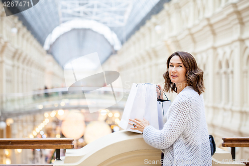 Image of woman with packages in a shopping center