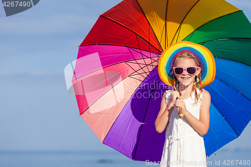 Image of little girl standing on the beach