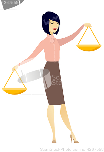 Image of Asian business woman holding balance scale.