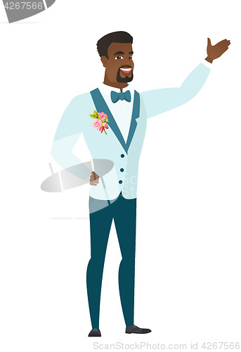 Image of African-american groom showing a direction.