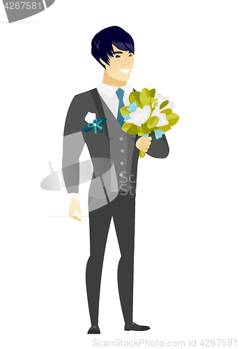 Image of Young caucasian groom with a bridal bouquet.