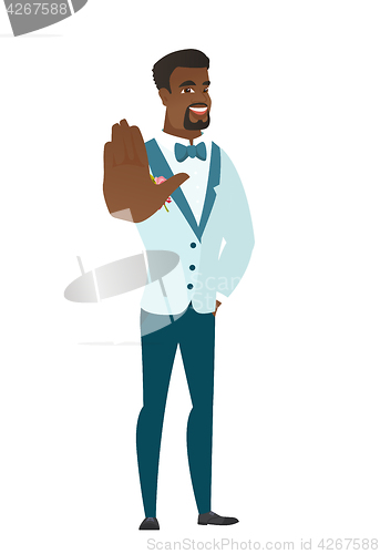 Image of African-american groom showing palm hand.