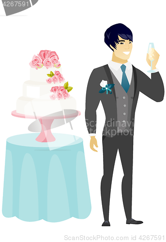 Image of Groom standing near cake with glass of champagne.