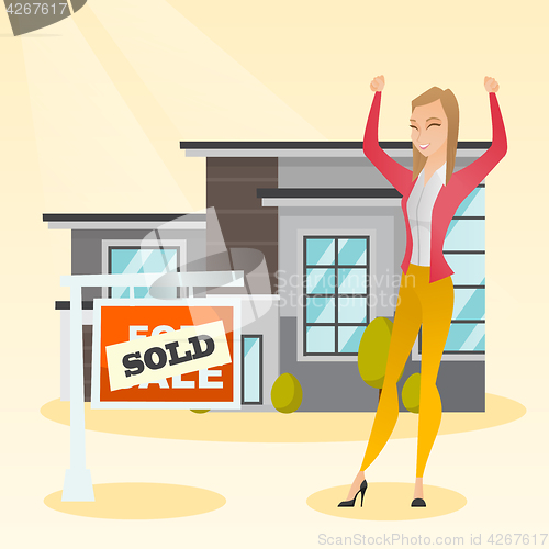 Image of Real estate agent with sold placard.