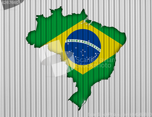 Image of Map and flag of Brazil on corrugated iron