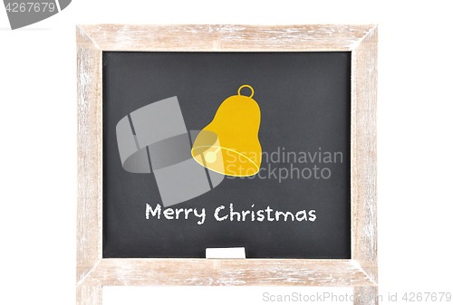 Image of Christmas greetings with bell on blackboard