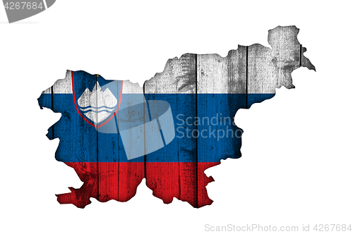 Image of Map and flag of Slovenia on weathered wood