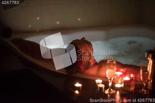 Image of man relaxing in the jacuzzi