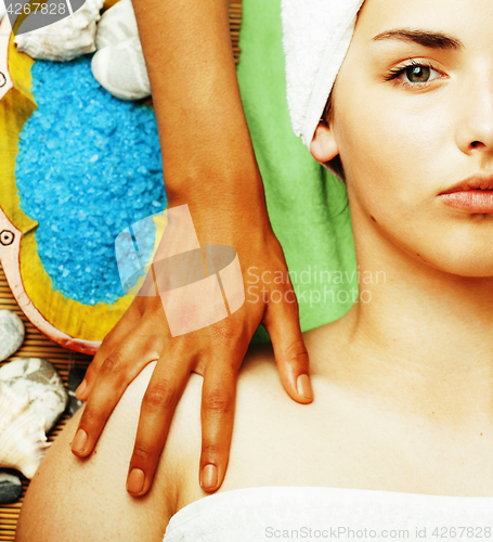 Image of stock photo attractive lady getting spa treatment in salon, close up asian hands on face