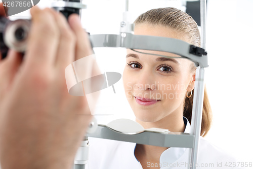 Image of Eye examination. Woman in ophthalmologist. Computer vision test