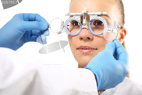 Image of Ophthalmologist, selection of corrective lenses.
