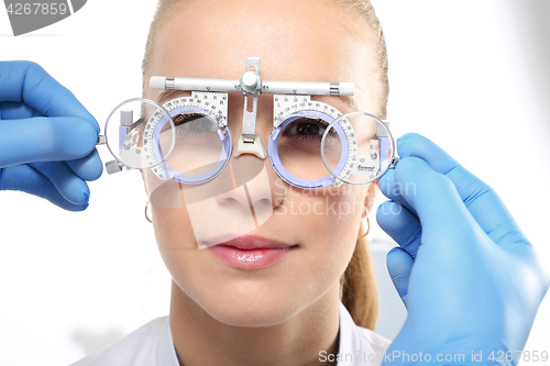 Image of Selection of spectacles, woman ophthalmologist. The patient at an ophthalmologist, selection of eyeglass