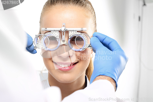 Image of Ophthalmologist, selection of corrective lenses.