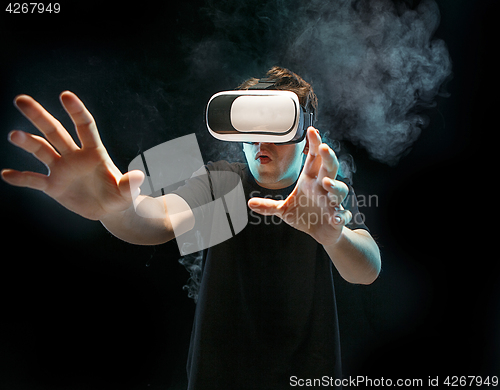 Image of The man with glasses of virtual reality. Future technology concept.