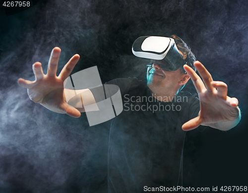 Image of The man with glasses of virtual reality. Future technology concept.