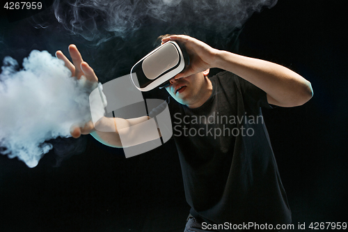 Image of The man with glasses of virtual reality. Future technology concept.