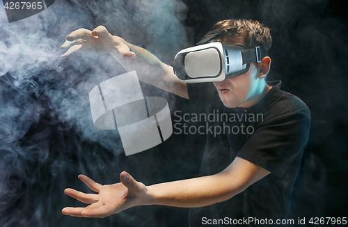 Image of The man with glasses of virtual reality. Future technology concept.