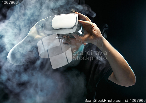 Image of The man with glasses of virtual reality. Future technology concept.