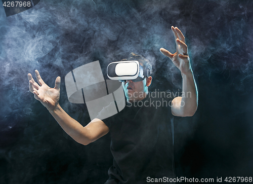 Image of The man with glasses of virtual reality. Future technology concept.