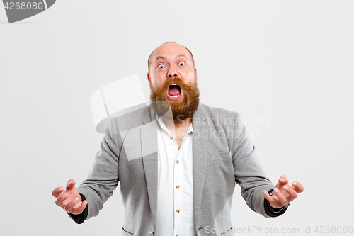 Image of Upset screaming man on empty background