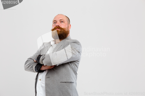 Image of Happy man with arms crossed