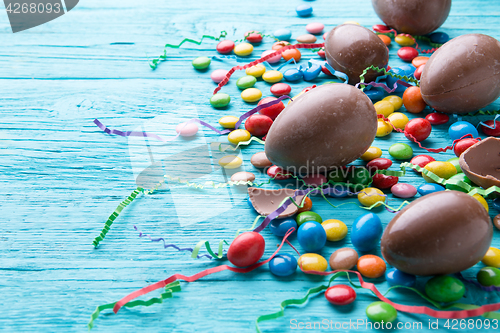 Image of Chocolate eggs, jelly beans, ribbons