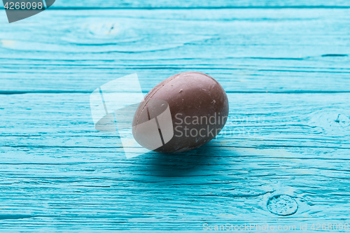 Image of Chocolate egg on blue table