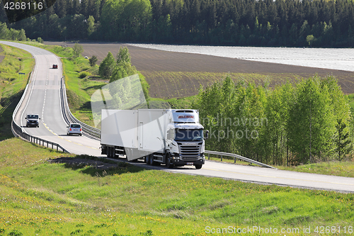 Image of White Temperature Controlled Transport Truck on Summer Road