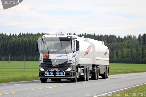 Image of White Mercedes-Benz Actros Fuel Tank Truck on Summer Road