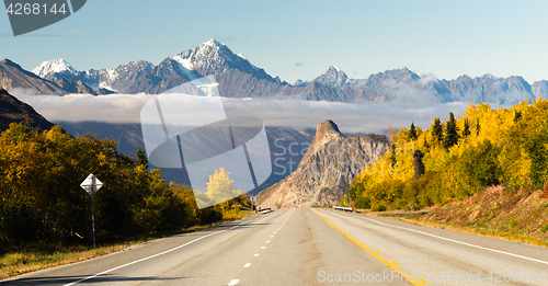 Image of Road Leads Down Fall Season Open Road Alaska