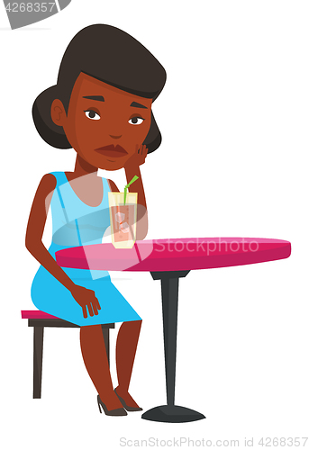 Image of Woman drinking cocktail at the bar.