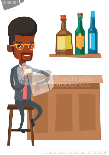 Image of Young man sitting at the bar counter.