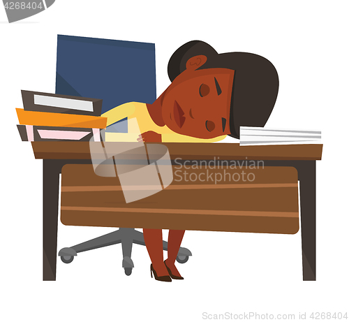 Image of Student sleeping at the desk with book.