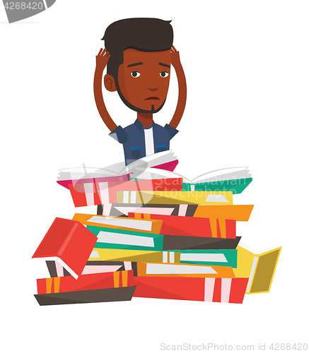 Image of Student sitting in huge pile of books.