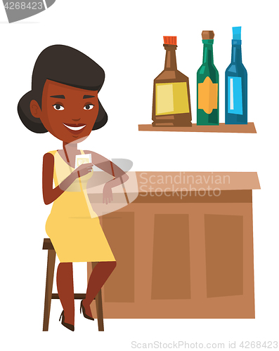 Image of Woman sitting at the bar counter.
