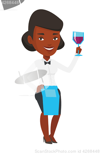 Image of Bartender holding a glass of wine in hand.