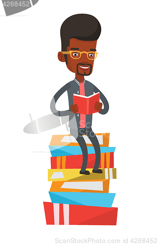 Image of Student sitting on huge pile of books.