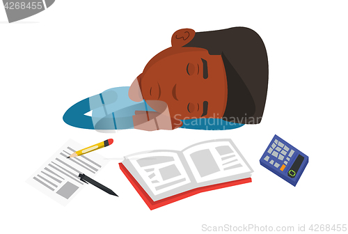 Image of Male student sleeping at the desk with book.