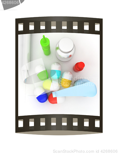 Image of Syringe, tablet, pill jar. 3D illustration. The film strip