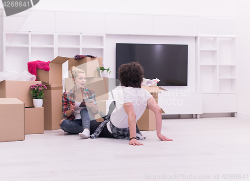 Image of young couple moving  in new house