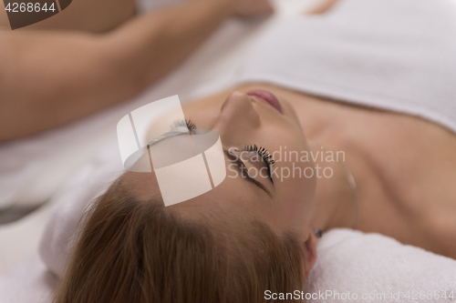 Image of young couple lying on massage table