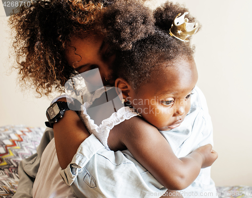 Image of adorable sweet young afro-american mother with cute little daugh