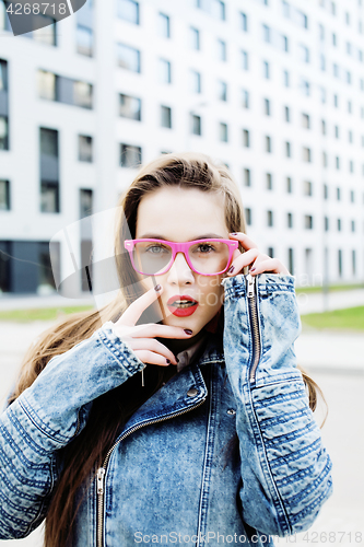 Image of young pretty hipster girl student with coffee cup posing adorable smiling, lifestyle people concept outdoor