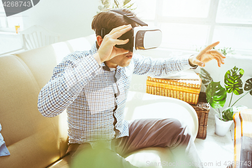 Image of The man with glasses of virtual reality. Future technology concept.